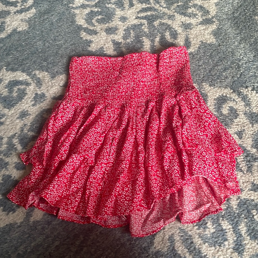 Adika, red skirt